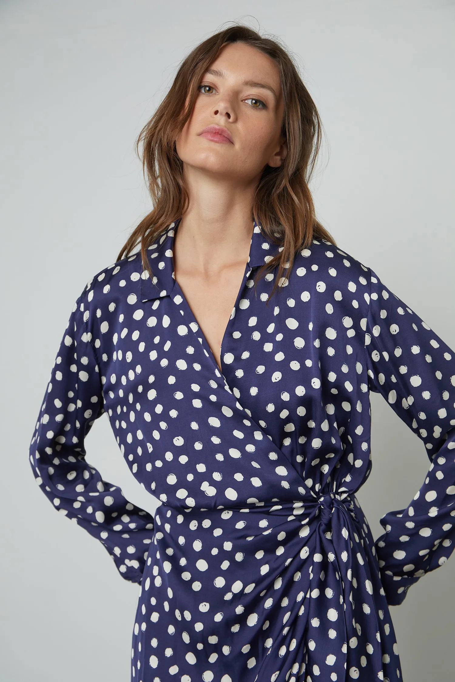 ZENDAYA POLKA DOT WRAP DRESS IN NAVY